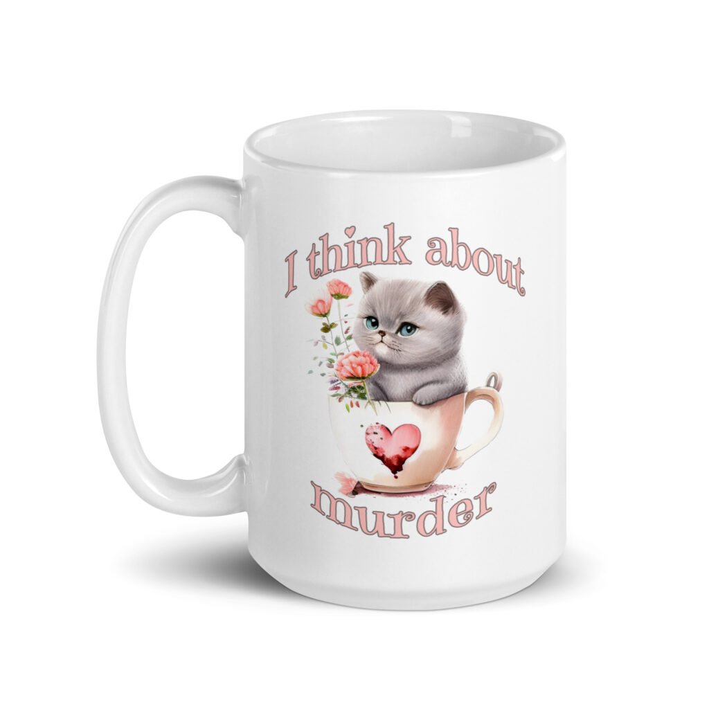 White ceramic mug that says 'I think about murder' with image of cute fluffy kitten sitting in a teacup printed on both sides.