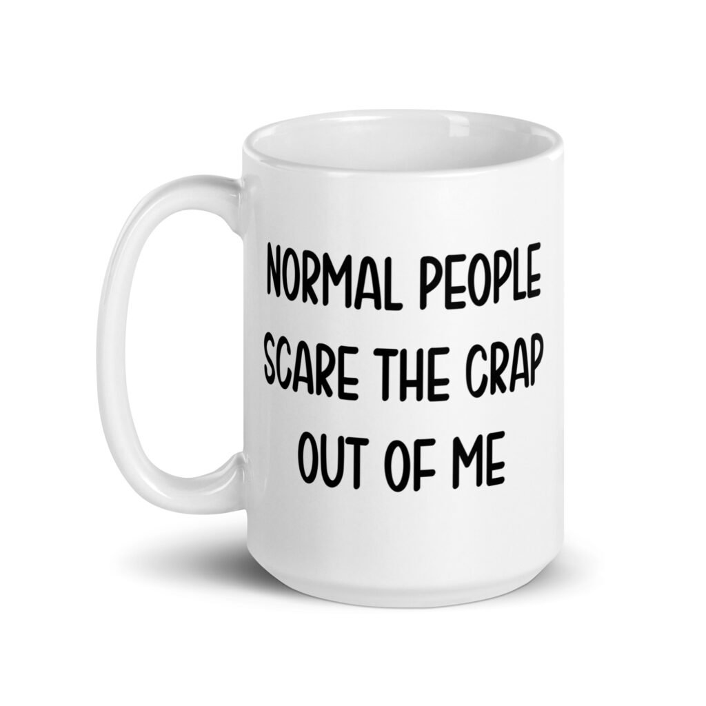 White ceramic coffee mug with the text 'Normal people scare the crap out of me' printed on both sides.