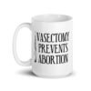 White ceramic coffee mug that has an image of a surgical scalpel and the phrase 'Vasectomy prevents abortion' printed on both sides.