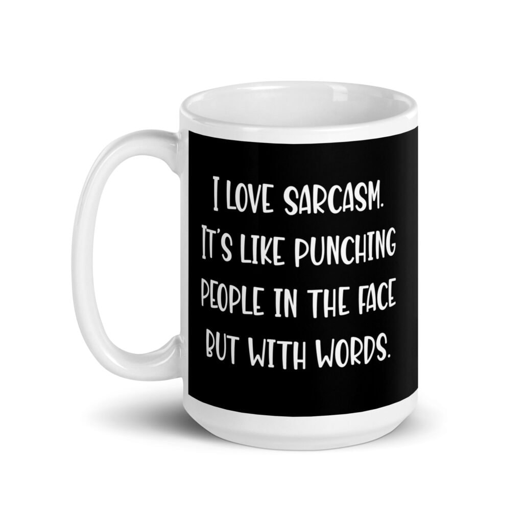 Black and white coffee mug with the text 'I love sarcasm. It's like punching people in the face but with words' printed on both sides.