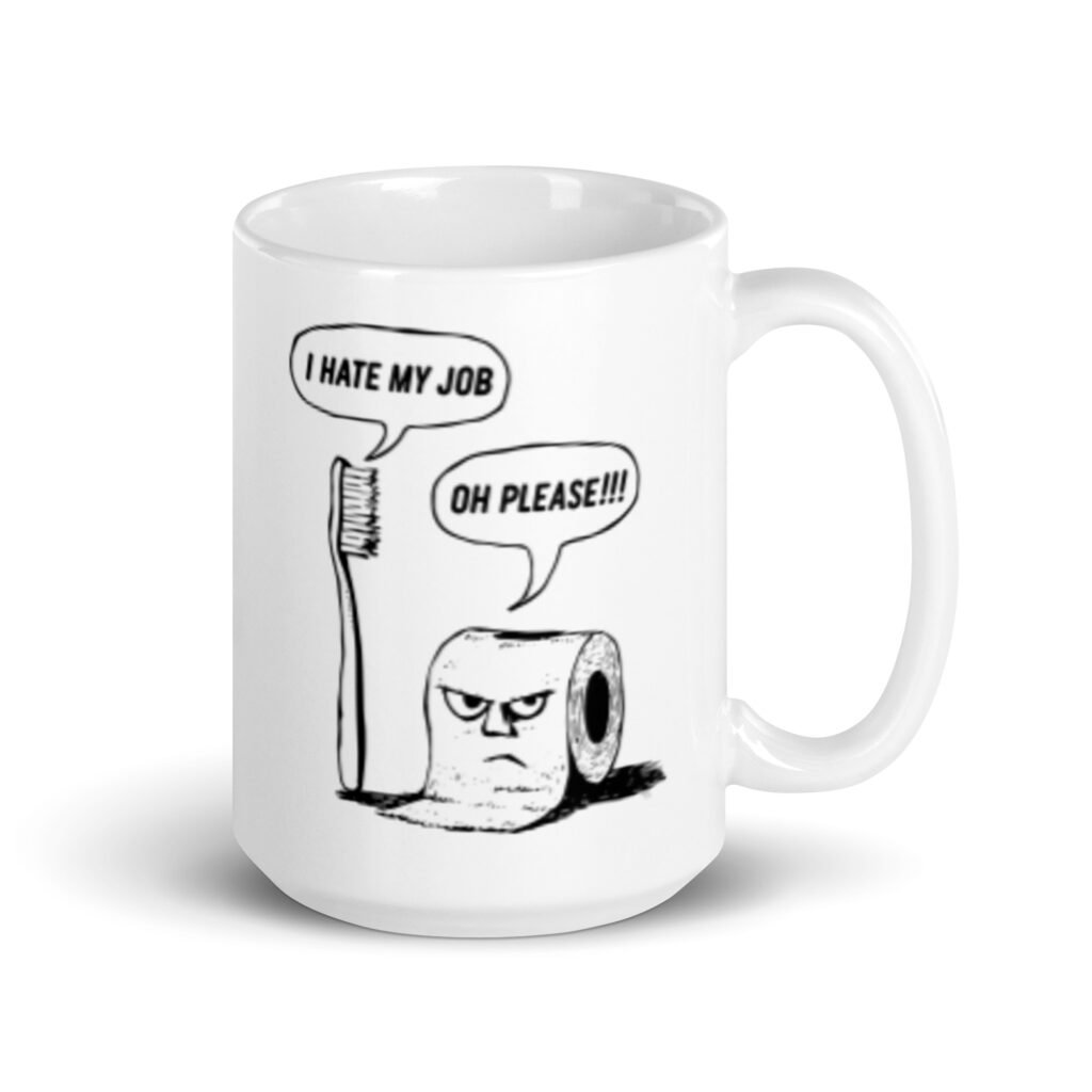White ceramic mug with a cartoon graphic on both sides. The cartoon is a line drawing of a toothbrush and roll of toilet paper. Both have speech bubbles above . The toothbrush says 'I hate my job' and the toilet paper says 'Oh please.'