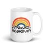 White ceramic coffee mug with a graphic of a rainbow and the words 'Spread negativity' printed on both sides.