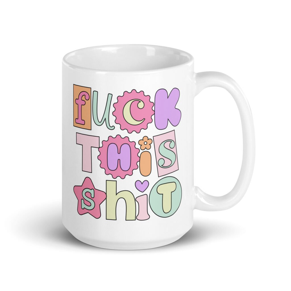 White ceramic coffee mug with colorful pastel font 'Fuck this shit' graphics printed on both sides.