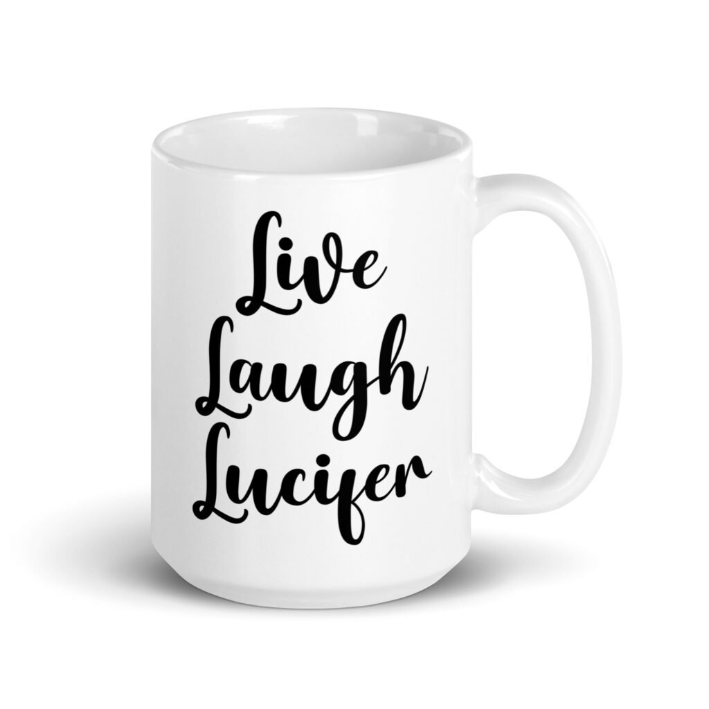 White ceramic coffee mug with the parody phrase 'Live, Laugh, Lucifer' printed on both sides.