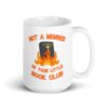 White ceramic coffee mug with image of a burning bible and the text 'Not a member of your little book club' printed on both sides.