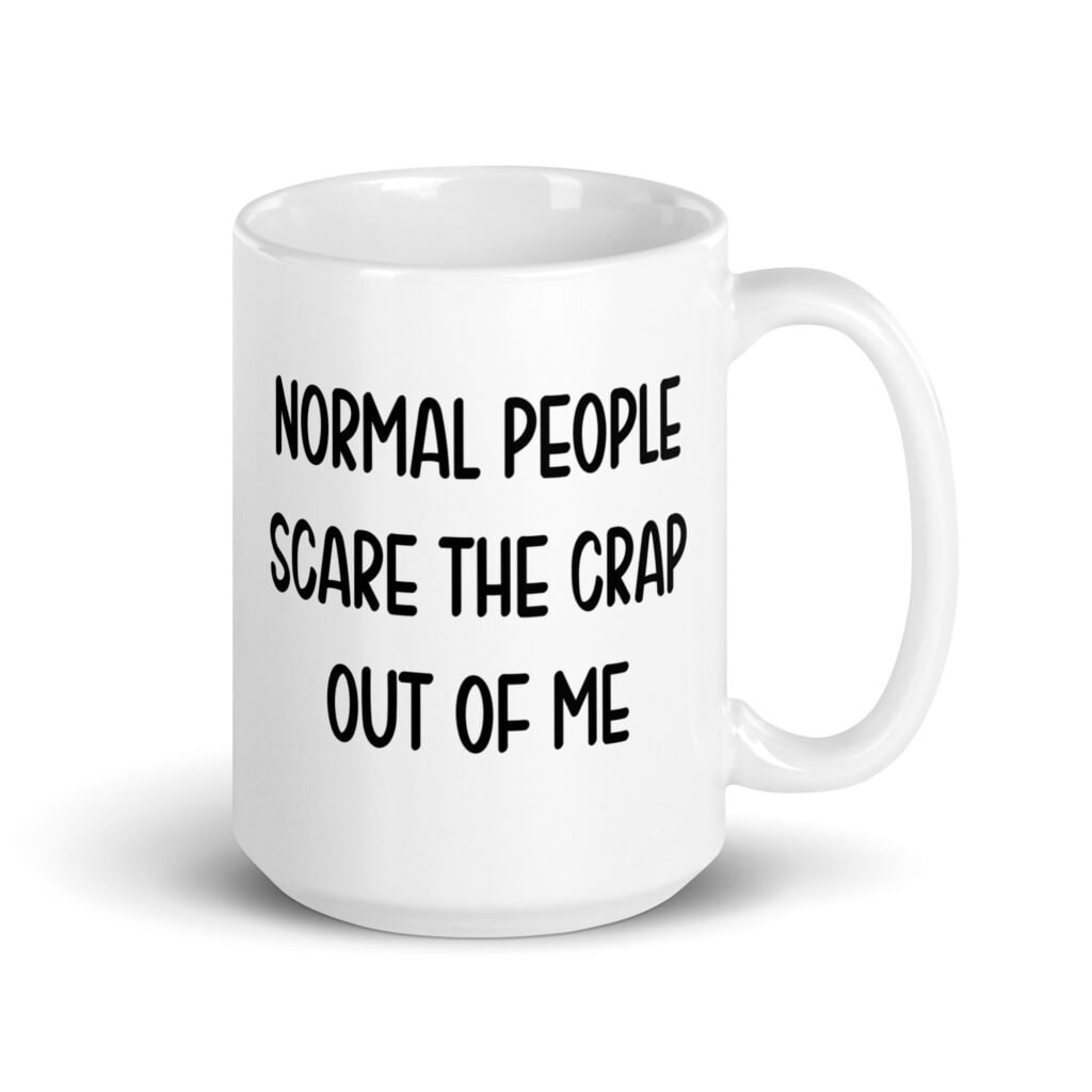 White ceramic coffee mug with the text 'Normal people scare the crap out of me' printed on both sides.