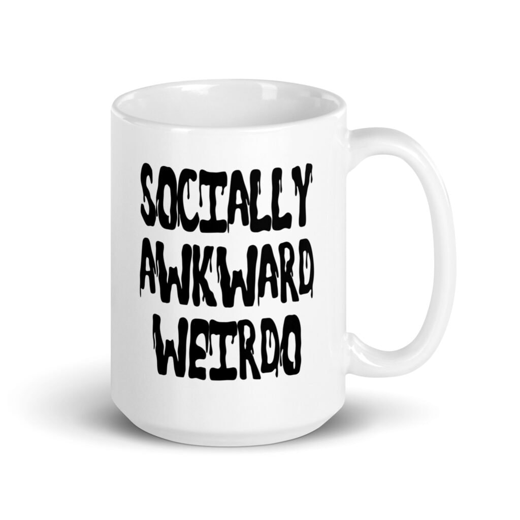 White ceramic coffee mug with the text 'Socially awkward weirdo' printed on both sides.