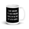 Black and white coffee mug with the text 'I love sarcasm. It's like punching people in the face but with words' printed on both sides.