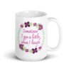 White ceramic coffee mug that has a colorful minimalistic style line drawing floral wreath with the text 'Sometimes I pee a little when I laugh' printed in the center of the wreath. The graphics are printed on both sides of the mug.