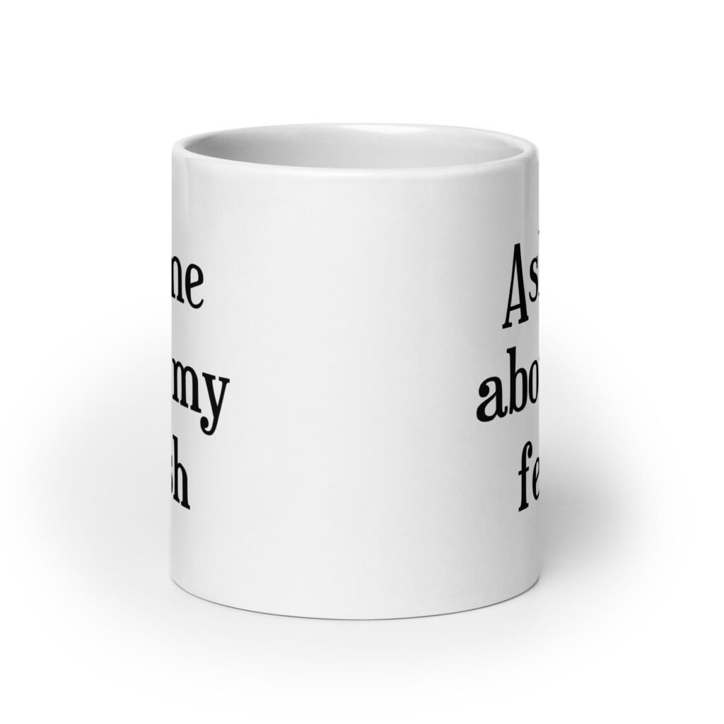 White ceramic mug with the text 'Ask me about my fetish' printed on both sides.