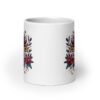 White ceramic mug with colorful boho floral design and the test 'Bad vibes only' printed on both sides.