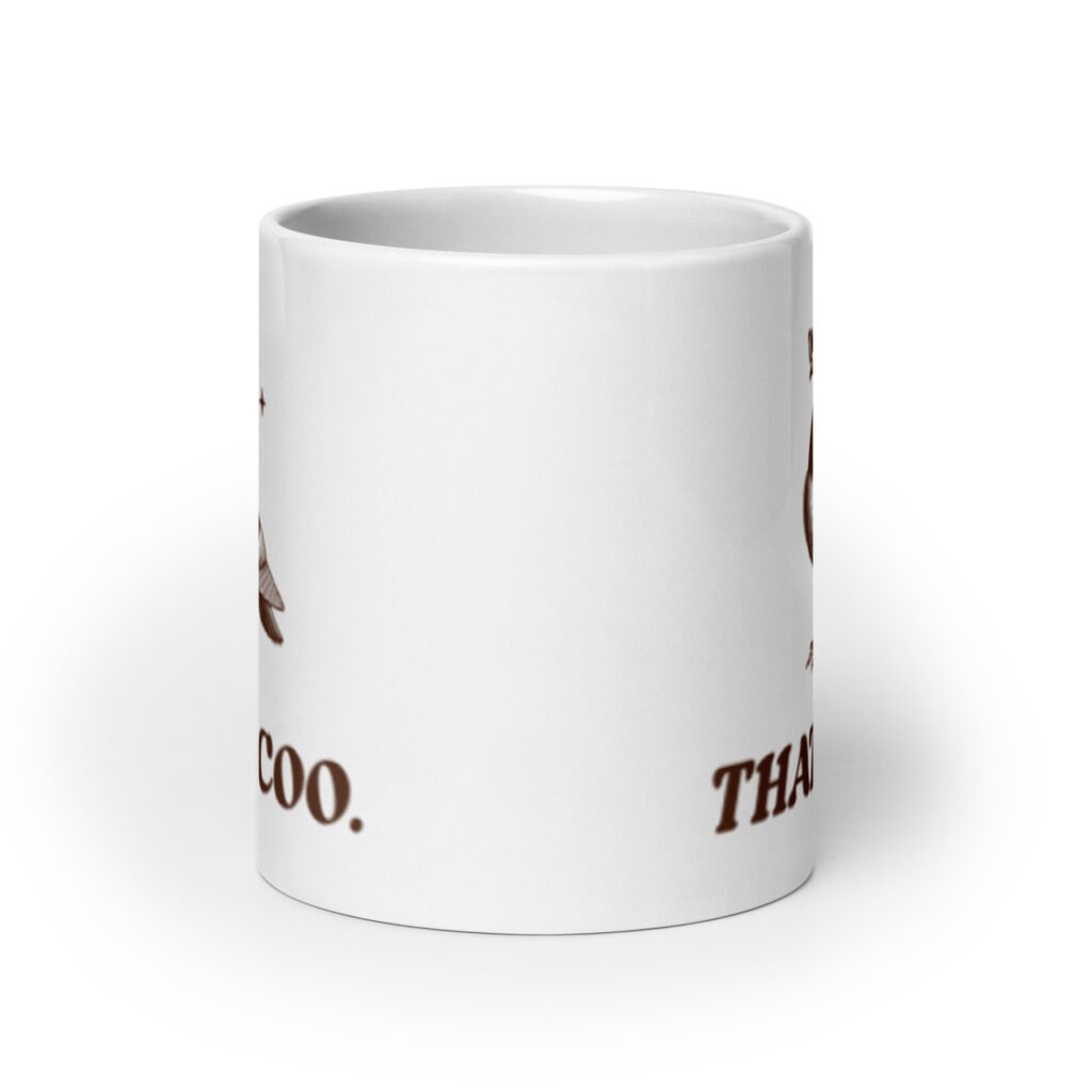 White ceramic mug with an image of a pigeon and the words 'That's coo.' printed on both sides.