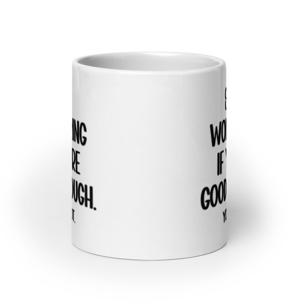 White ceramic mug with the phrase 'Stop wondering if you're good enough. You're not.' printed on both sides of the mug. The words 'You're not' are smaller then the rest.
