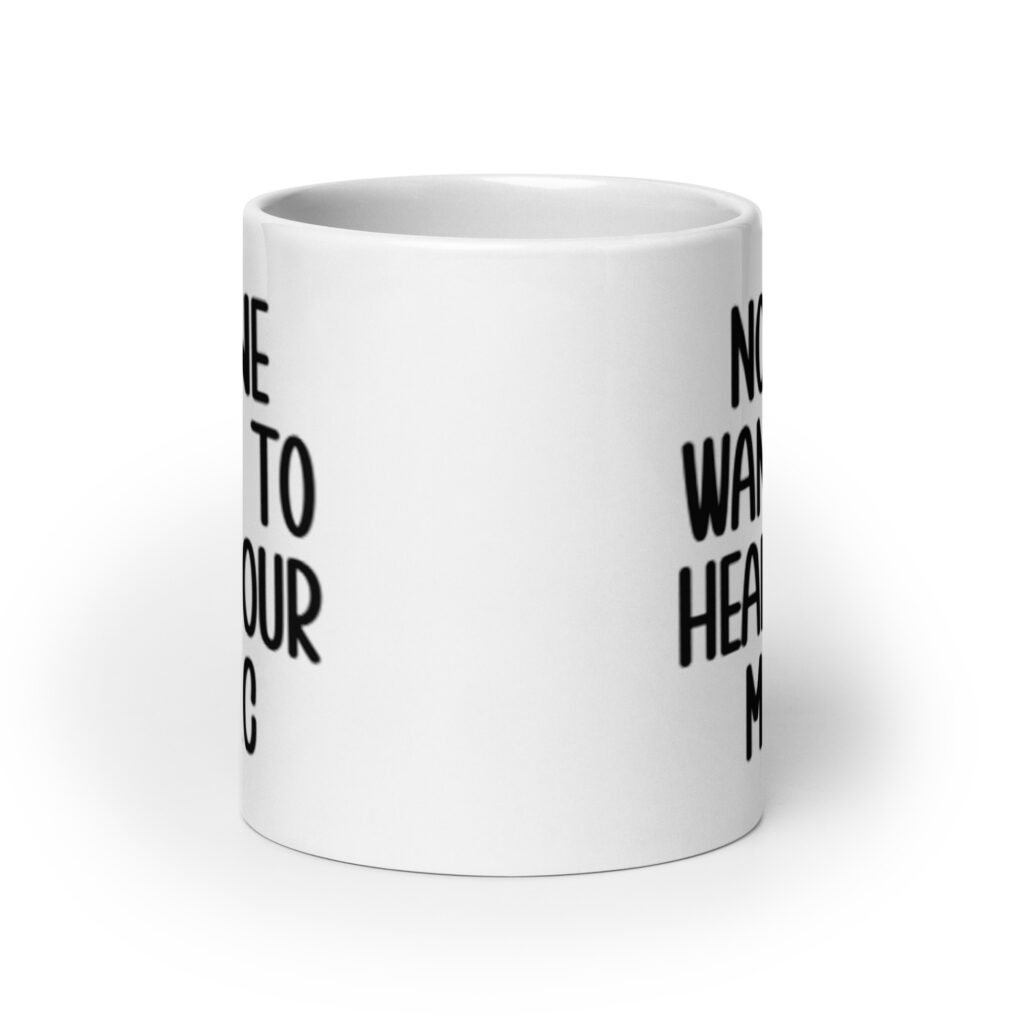 White ceramic mug with the text 'No one wants to hear your music' printed on both sides.