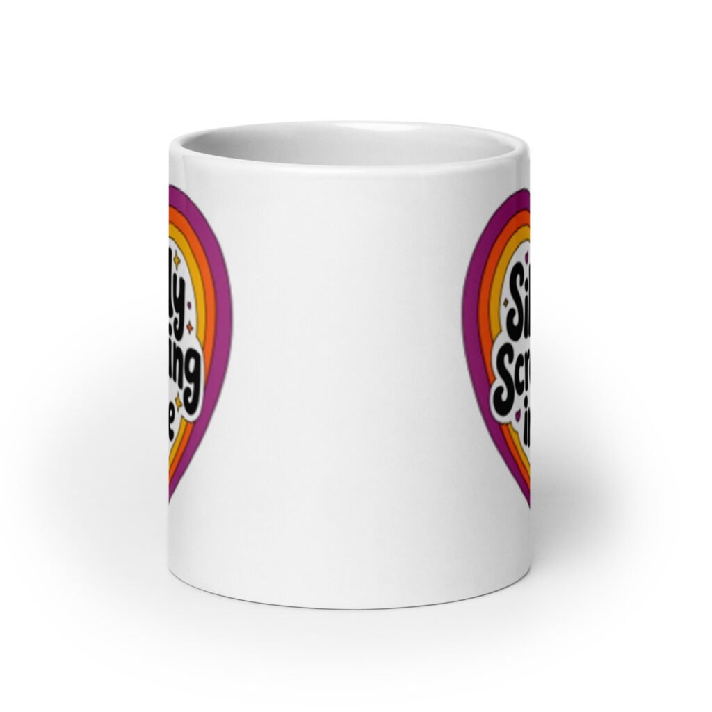 White ceramic coffee mug with a colorful graphic that says 'Silently screaming inside'. The graphics are printed on both sides of the mug.