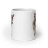 White ceramic coffee mug with an image of a donkey with wise owl sitting on it printed on both sides of the mug.