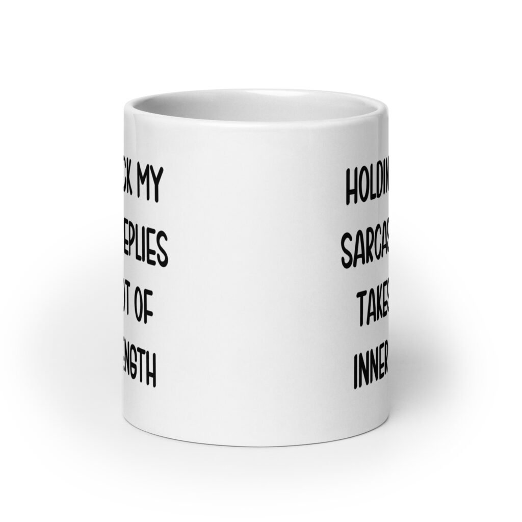 White ceramic mug with the phrase 'Holding back my sarcastic replies takes a lot of inner strength' printed on both sides of the mug.