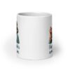 White ceramic coffee mug with an image of grey haired older woman enjoying a bite of a piece of cake with the words 'I hope your cake is as moist as I am' printed on both sides.