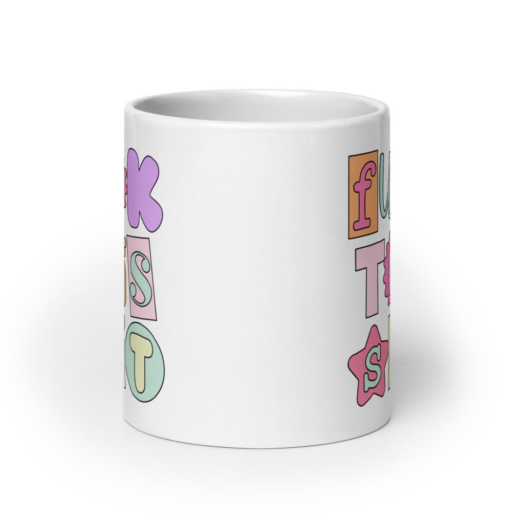 White ceramic coffee mug with colorful pastel font 'Fuck this shit' graphics printed on both sides.