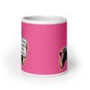 White ceramic coffee mug with pink color wrapped around. The mug has a graphic of an angry looking retro woman holding a knife and a sign. The sign says 'Tell me to calm down. I dare you.' The graphic is printed on both sides of the mug.