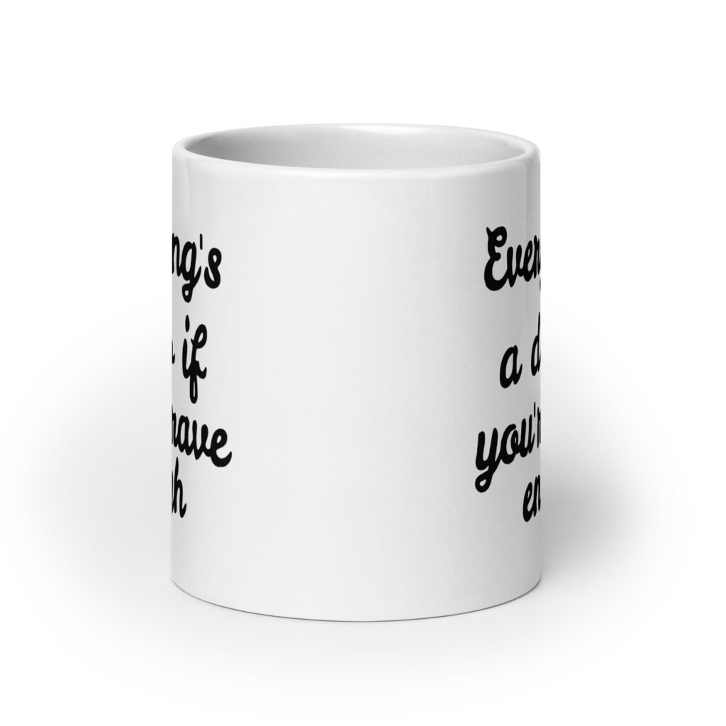 White ceramic coffee mug with the text 'Everything's a dildo if you're brave enough' printed on both sides.