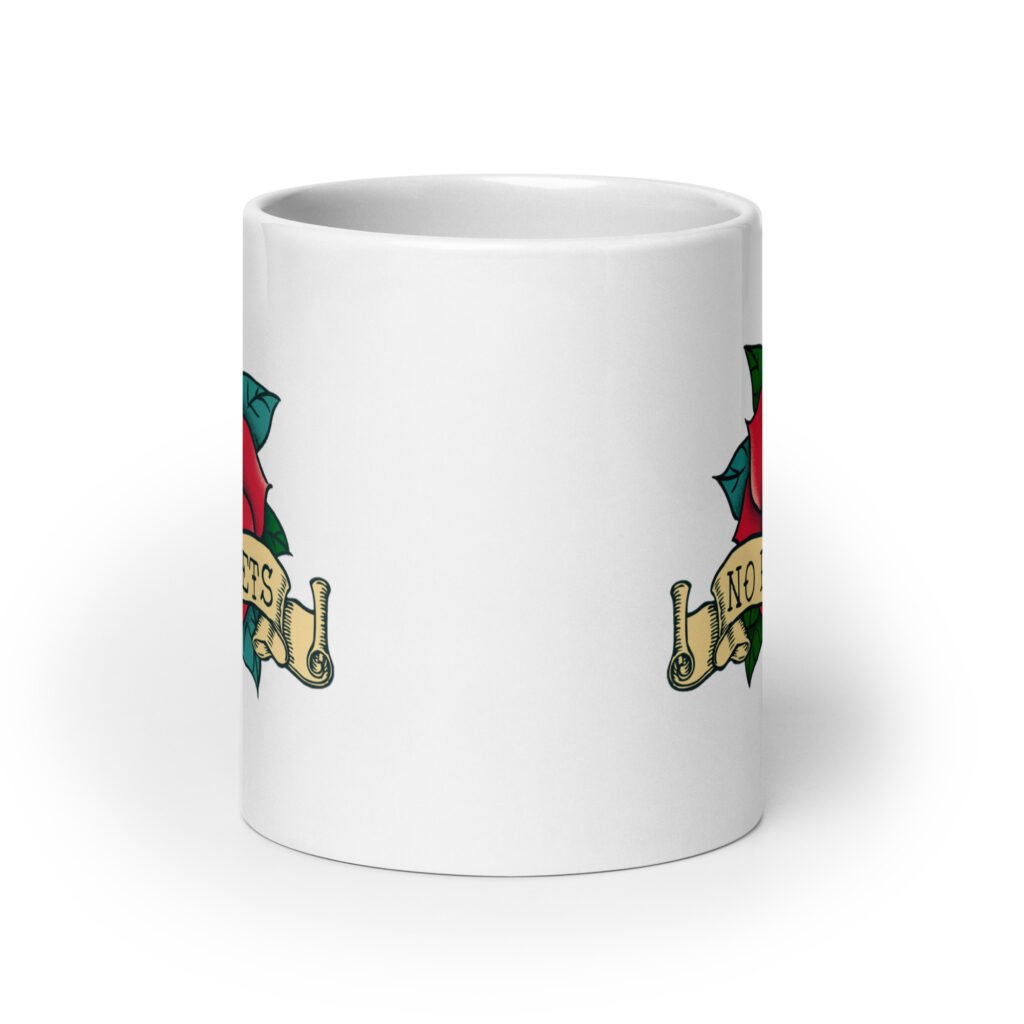 White ceramic coffee mug with funny image of an old school rose flash tattoo with the words 'No ragrets' intentionally misspelled. The graphics are printed on both sides of the mug.