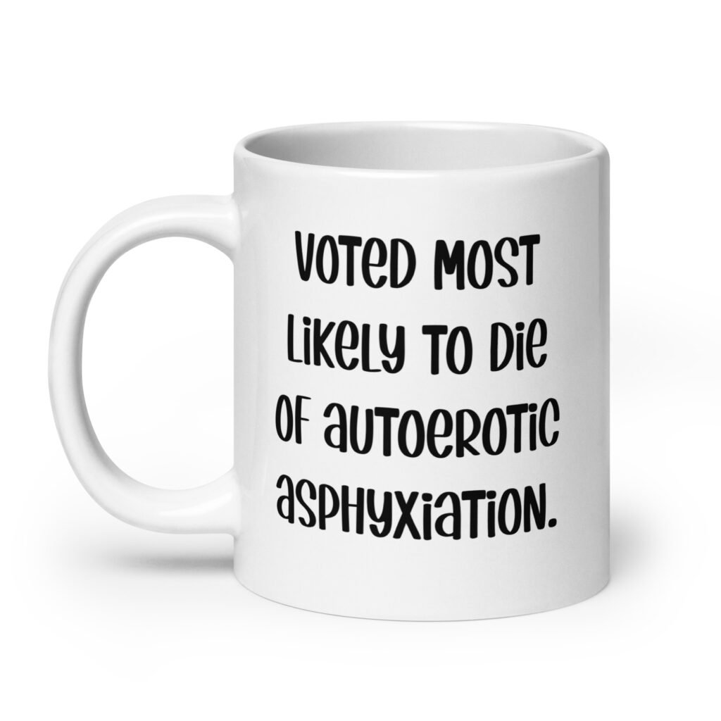 White ceramic mug with the text 'Voted most likely to die of autoerotic asphyxiation.' printed on both sides.