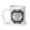 White ceramic mug with a colorful doodle graphic and the words 'I support a man's right to shut the hell up.' The design is printed on both sides of the mug.