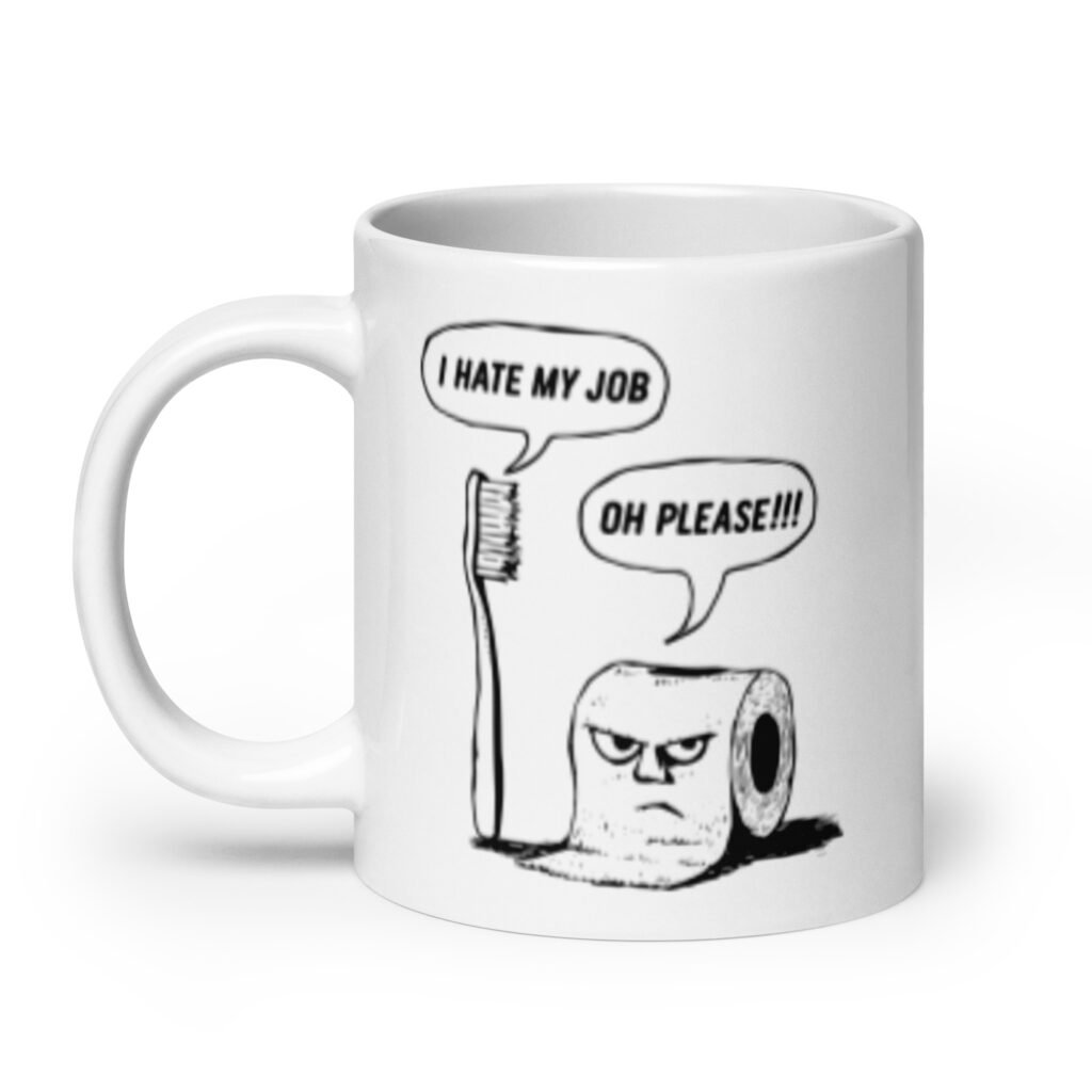 White ceramic mug with a cartoon graphic on both sides. The cartoon is a line drawing of a toothbrush and roll of toilet paper. Both have speech bubbles above . The toothbrush says 'I hate my job' and the toilet paper says 'Oh please.'