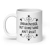 White ceramic mug with the text 'Undiagnosed, but something ain't right' printed on both sides.