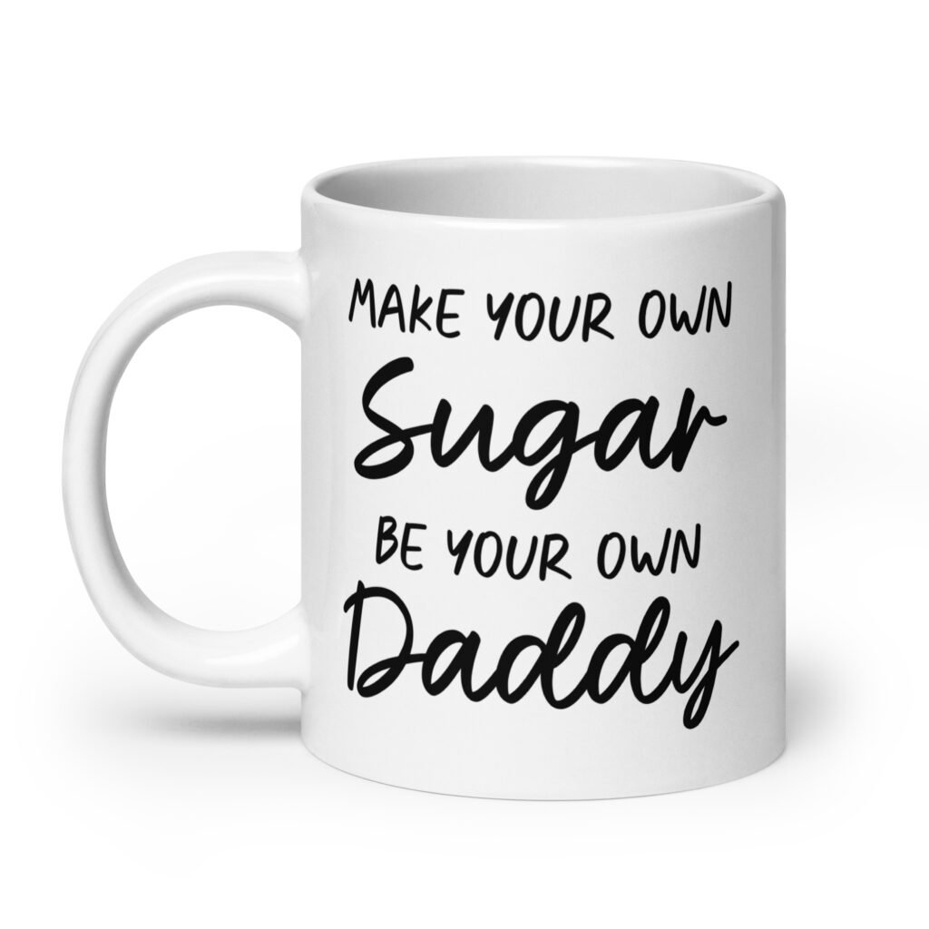 White ceramic coffee mug with the text 'Make your own sugar Be your own Daddy' printed on both sides.