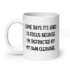 White ceramic mug with the phrase 'Some days it's hard to focus because I'm distracted by my own cleavage' printed on both sides.