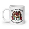 White ceramic mug with image of 2 mermaids and the text 'Real mermaids smoke seaweed' printed on both sides.