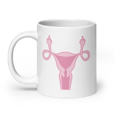 White ceramic coffee mug with with image of a pink uterus flipping middle finger graphic printed on both sides.