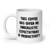 White ceramic coffee mug with the phrase 'This coffee has given me unrealistic expectations of productivity' printed on both sides.