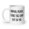 White ceramic coffee mug with the text 'Normal people scare the crap out of me' printed on both sides.