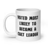 White ceramic coffee mug with the text 'Voted most likely to become a cult leader' printed on both sides.