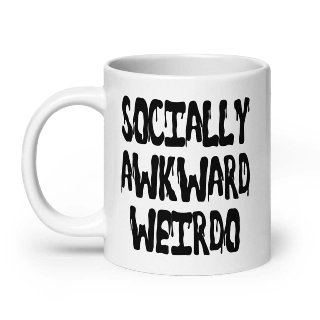 White ceramic coffee mug with the text 'Socially awkward weirdo' printed on both sides.