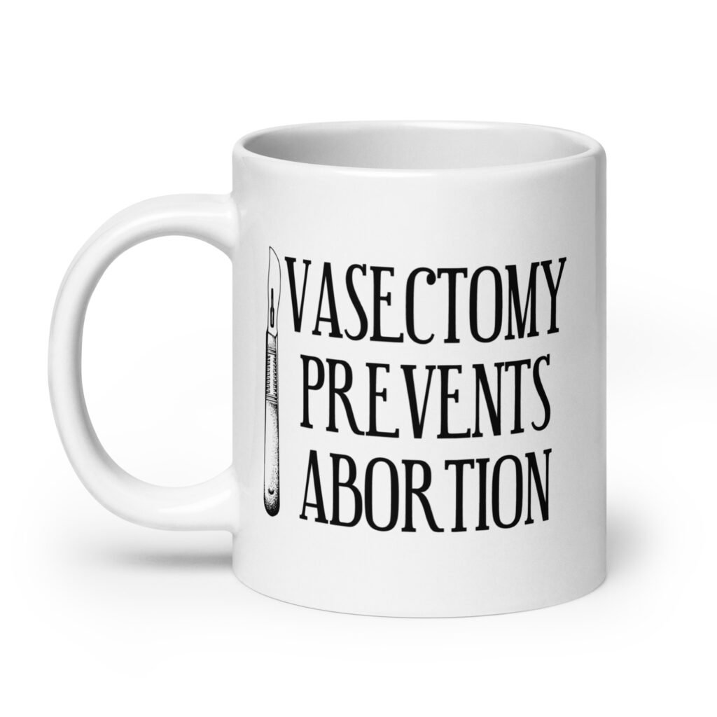 White ceramic coffee mug that has an image of a surgical scalpel and the phrase 'Vasectomy prevents abortion' printed on both sides.