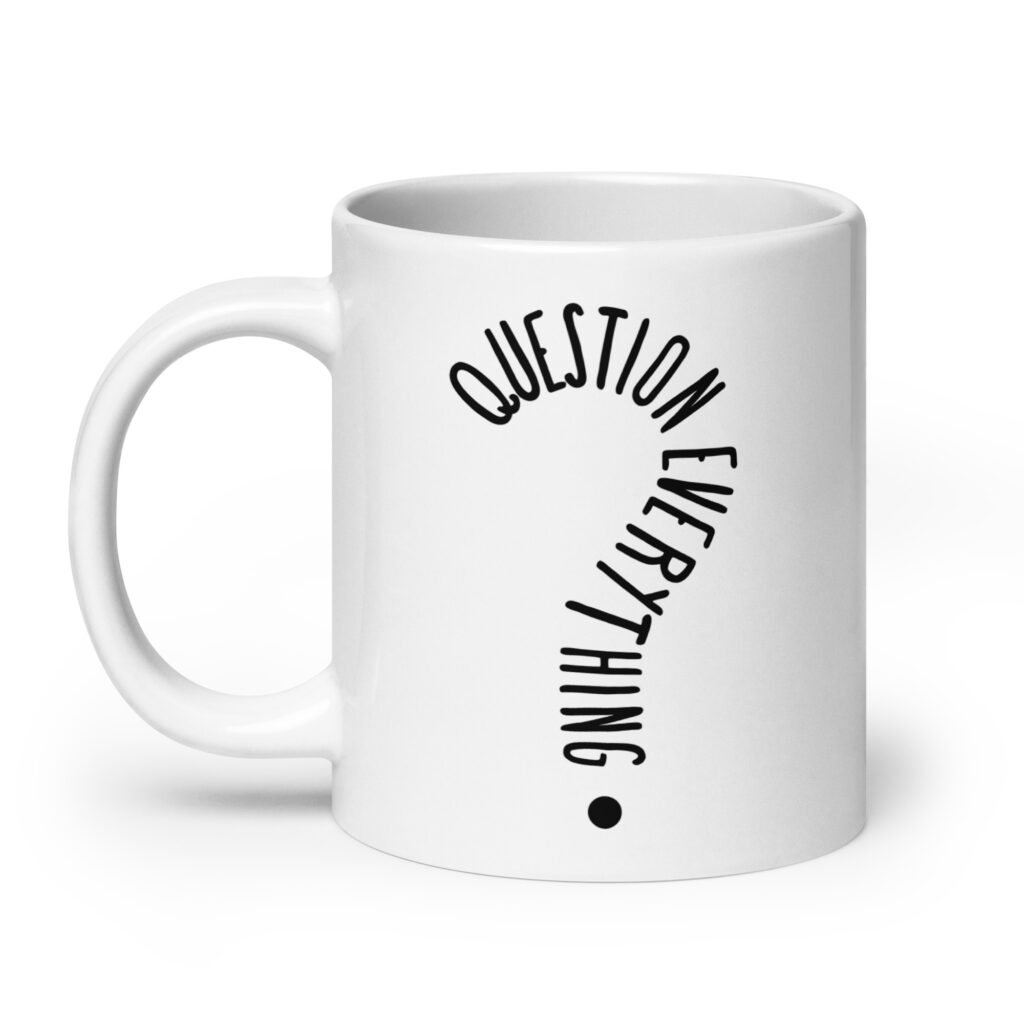 White ceramic coffee mug with the text 'Question everything' printed on both sides. The words are in the shape of a question mark.