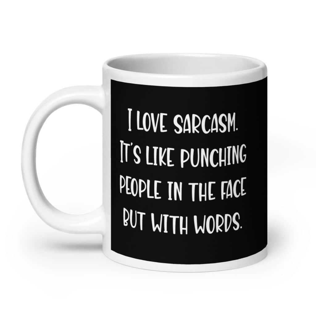 Black and white coffee mug with the text 'I love sarcasm. It's like punching people in the face but with words' printed on both sides.