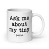 White ceramic mug with the text 'Ask me about my tiny penis' printed on both sides. The word tiny is much smaller than the rest of the text.