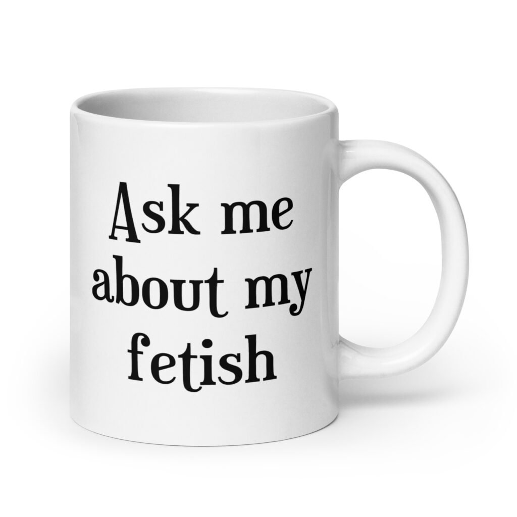 White ceramic mug with the text 'Ask me about my fetish' printed on both sides.