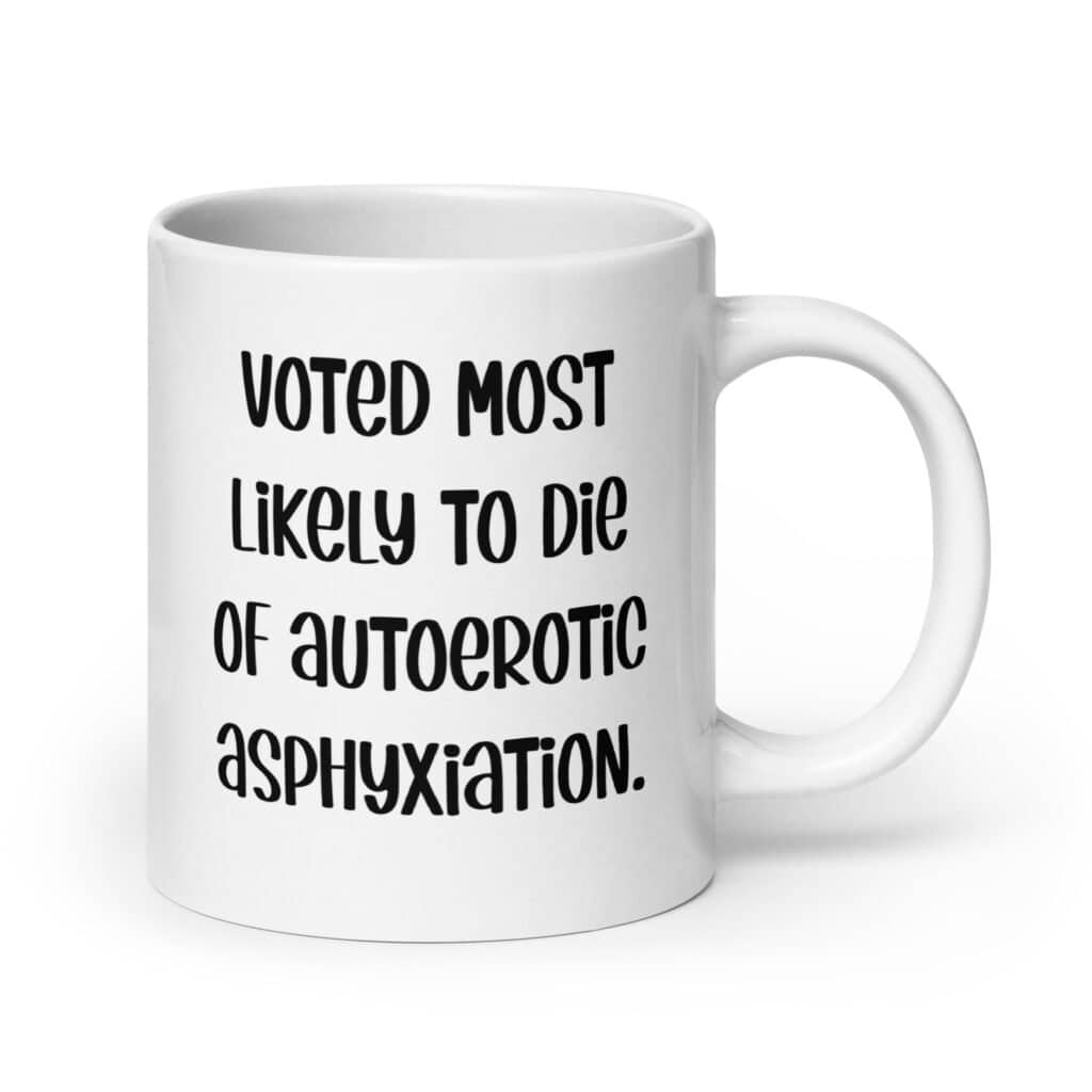 White ceramic mug with the text 'Voted most likely to die of autoerotic asphyxiation.' printed on both sides.