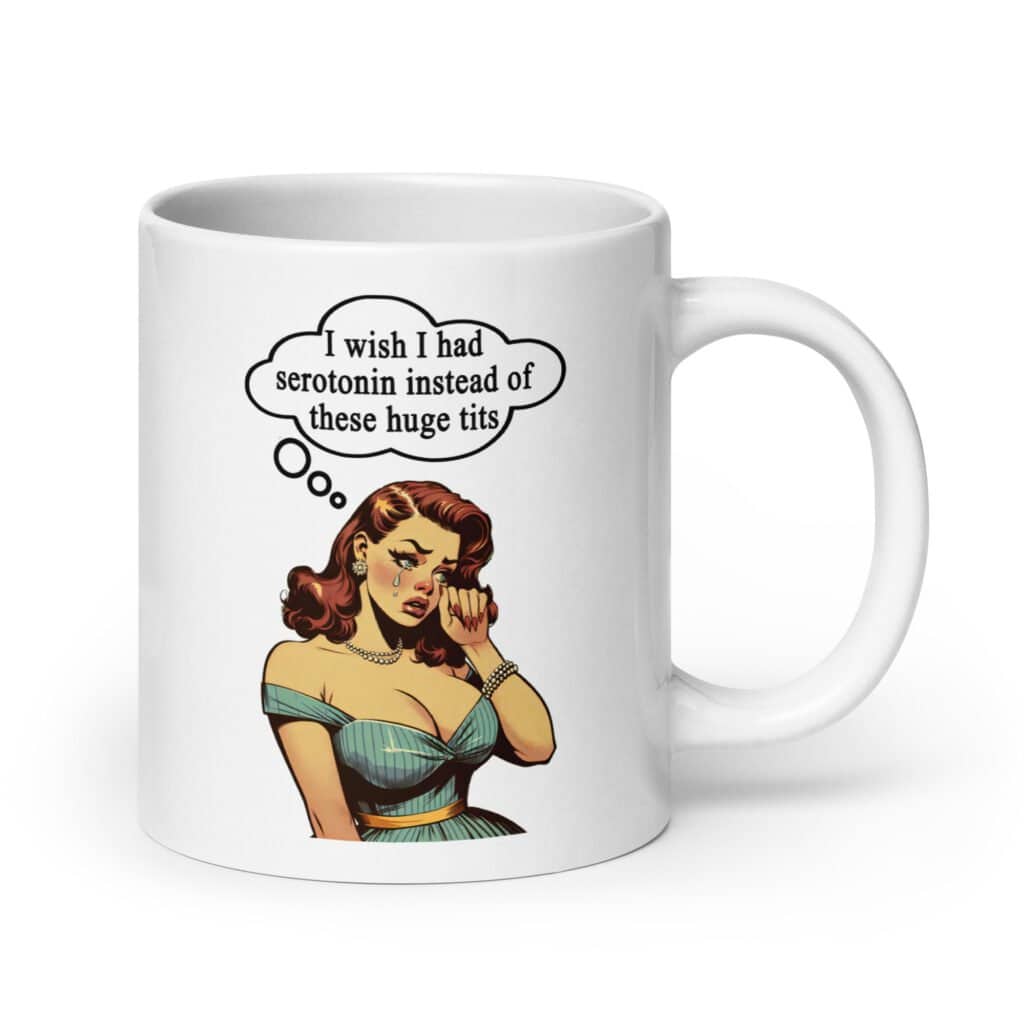 White ceramic coffee mug with an image of a busty pin-up lady with thought bubble that says 'I wish I had serotonin instead of these huge tits' printed on both sides of the mug.