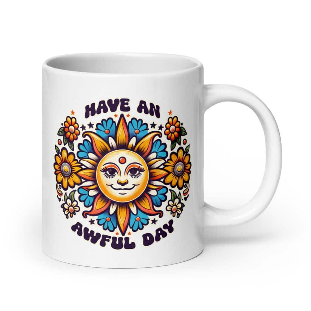 White ceramic coffee mug with a sun graphic and the text 'Have an awful day' printed on both sides.
