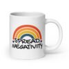 White ceramic coffee mug with a graphic of a rainbow and the words 'Spread negativity' printed on both sides.