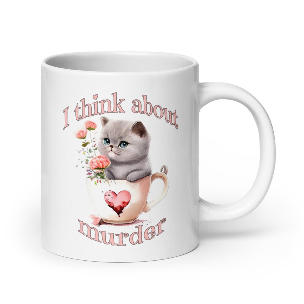 White ceramic mug that says 'I think about murder' with image of cute fluffy kitten sitting in a teacup printed on both sides.