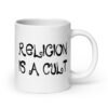White ceramic coffee mug with the text 'Religion is a cult' printed on both sides.