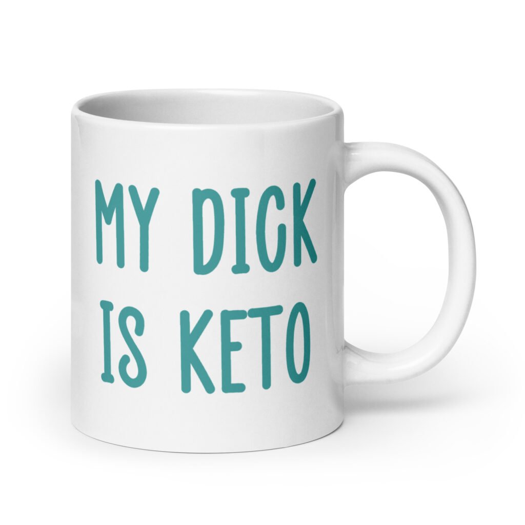 White ceramic coffee mug with the text 'My dick is keto' printed on both sides in turquoise font.